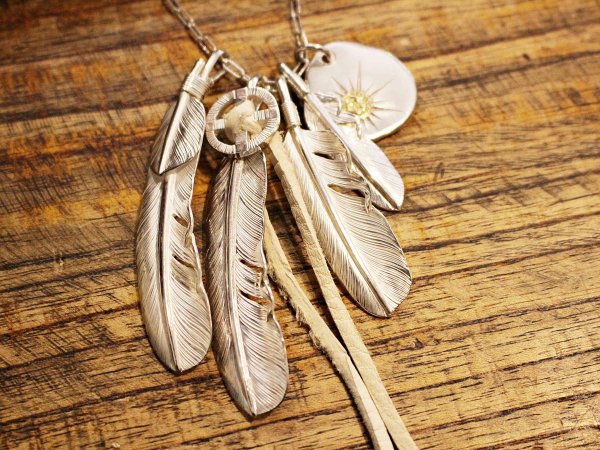 FEATHER (L) with MEDICINE WHEEL / SUNSHINE STUDIO