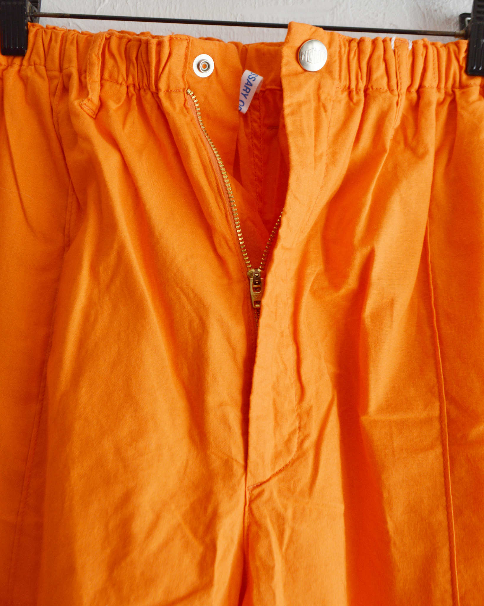 パンツ Orange NECESSARY or UNNECESSARY ネセサリーオアアンネセサリー N.O.UN